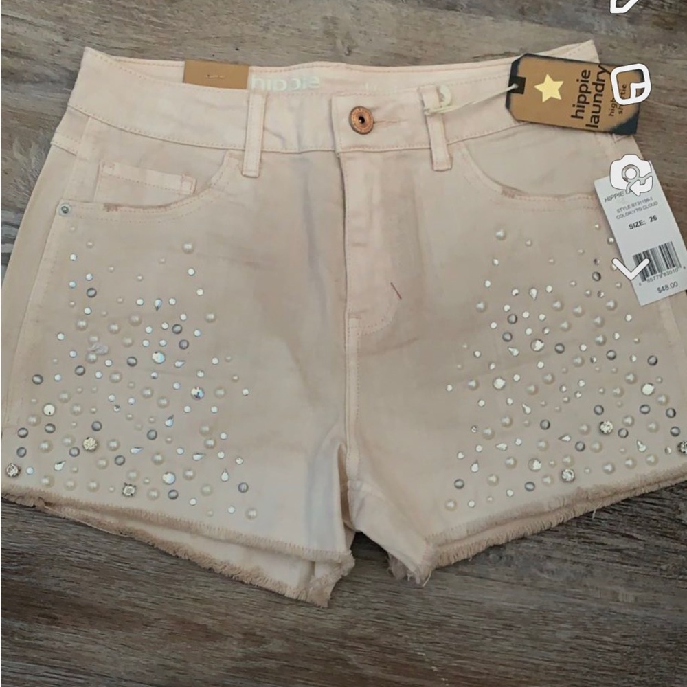 Women Jean Shorts never worn. Size 26. Light pink with Rhinestones.